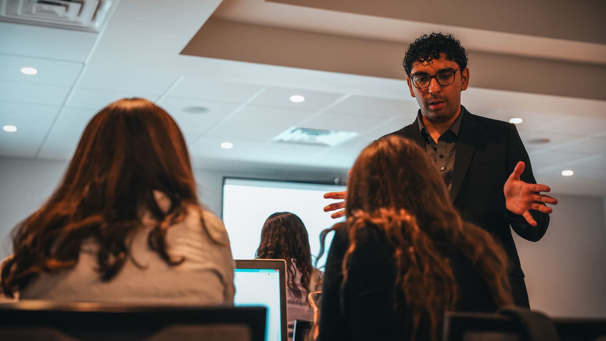 Presenter speaking to attendees during a practical AI seminar